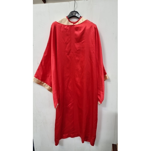 678 - Sable red robe, made in Ireland, size 55, features classic design with contrasting trim. Bit of Sist... 