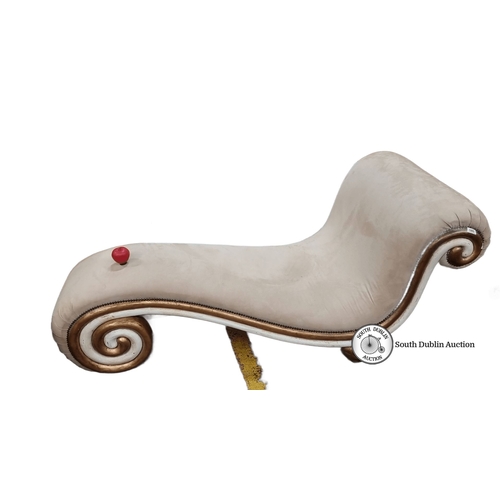 680 - Star Lot : Curved chaise longue with beige upholstery, ornamental gold-toned scroll detailing, and w... 