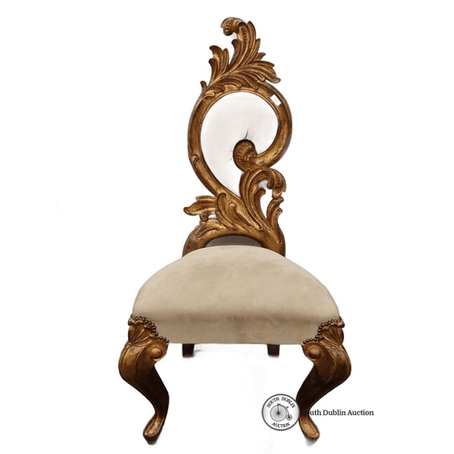 681 - A very tall Ornate Rococo-style chair with gilt wood frame and plush beige upholstery has intricatel... 