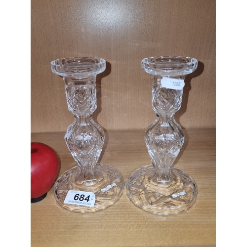 684 - Pair of Waterford Crystal candle holders, featuring intricate cut-glass design.