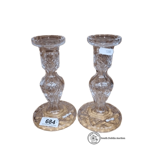 684 - Pair of Waterford Crystal candle holders, featuring intricate cut-glass design.