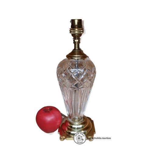 685 - Waterford Crystal table lamp with brass fittings features an elegant cut glass design.