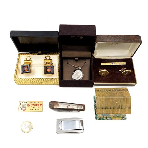 496 - A collection of items consisting of a souvenir thimble, together with a pair of gem set cufflinks a ... 