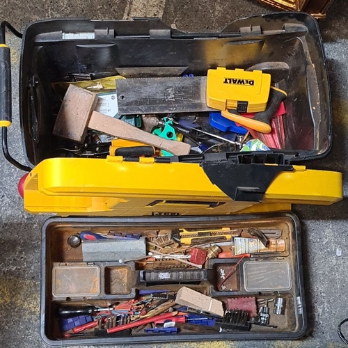 758 - A Large JCB mobile rolling toolbox with assorted tools, including a saw and tape measure. It has dur... 