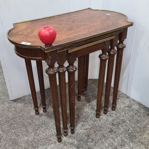 765 - Set of three nesting tables, from the early 20th century, featuring inlaid wood tops and turned legs... 