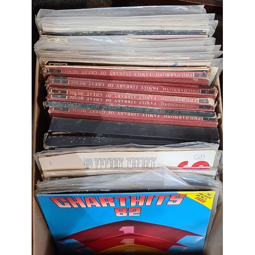 767 - Two boxes of assorted vinyl records, including 