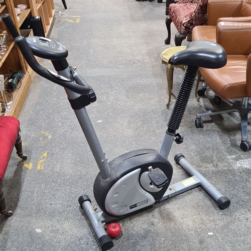 774 - Pro Fitness exercise bike with digital display for speed, distance, and calories. Compact design.