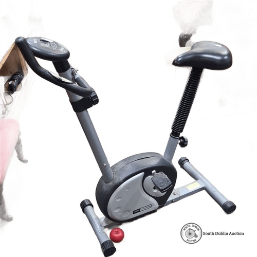 774 - Pro Fitness exercise bike with digital display for speed, distance, and calories. Compact design.