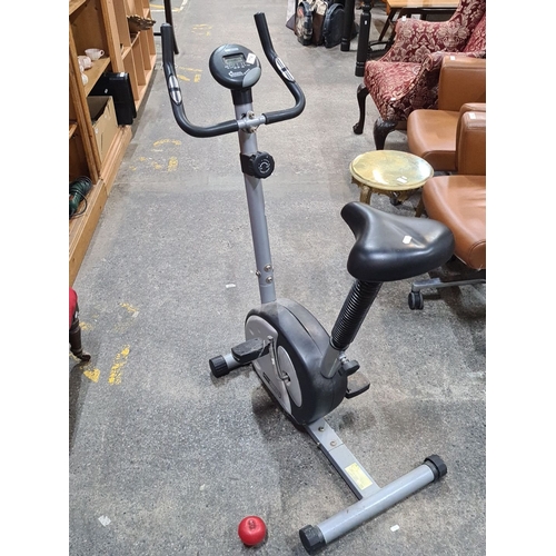 774 - Pro Fitness exercise bike with digital display for speed, distance, and calories. Compact design.