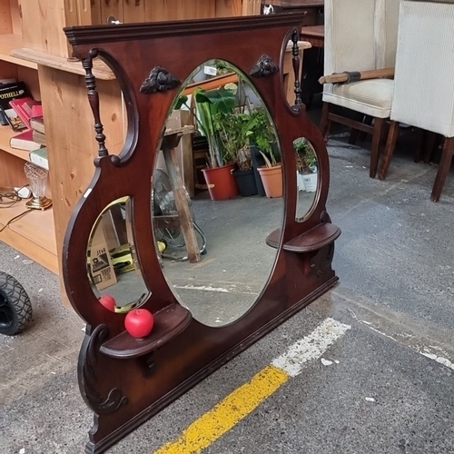 1021 - Edwardian mahogany overmantel mirror with decorative carvings and dual side shelves, featuring an ov... 