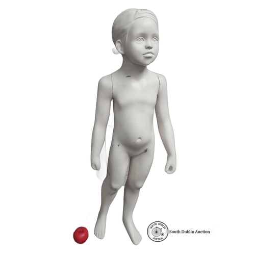 1024 - Child mannequin with a painted finish, mounted on a round glass base.