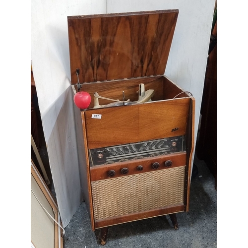 957 - Mid-century Pilot Radio Model 60 features a wooden cabinet and integrated gramophone. Manufactured b... 