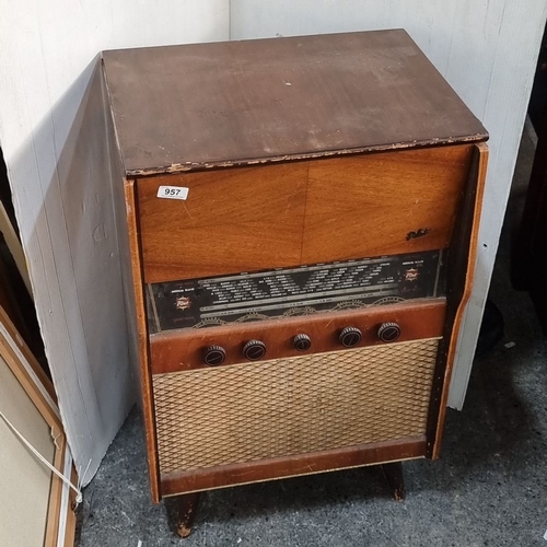 957 - Mid-century Pilot Radio Model 60 features a wooden cabinet and integrated gramophone. Manufactured b... 