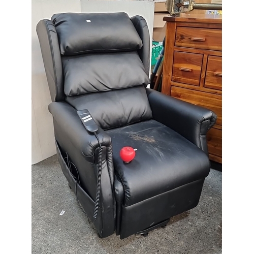 958 - Recliner chair with black upholstery features an Okin Deltadrive motor mechanism with adjustable set... 