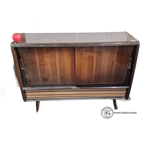 961 - Mid-century modern radiogram by Nat Ross, Cork. Features sliding doors, compact design, and distinct... 