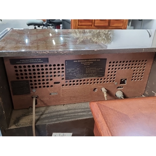 961 - Mid-century modern radiogram by Nat Ross, Cork. Features sliding doors, compact design, and distinct... 