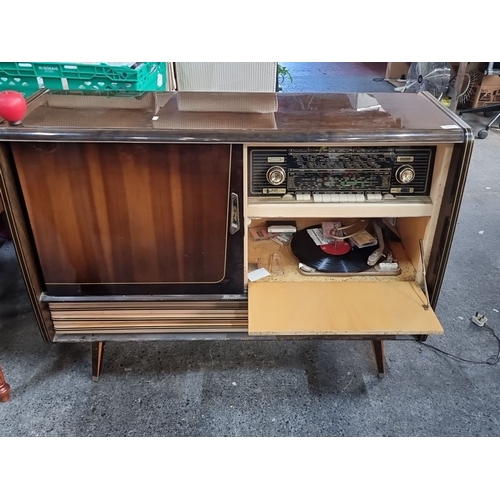 961 - Mid-century modern radiogram by Nat Ross, Cork. Features sliding doors, compact design, and distinct... 