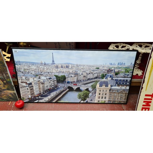 305 - A very large rectangular print of the Parisian Cityscape. Housed in a black frame behind glass.
Very... 