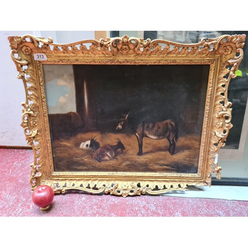 313 - A wonderful original oil on canvas painting. Features a donkey with goats in a stable. Rendered in a... 