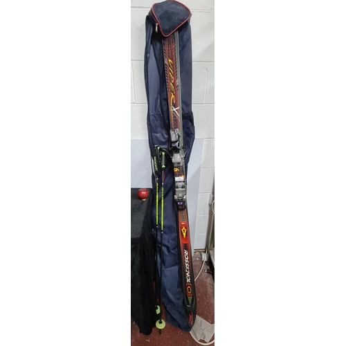 862 - A pair of 'Rossignol Dualtec Generation' skis accompanied by 2 Composite skiing poles. Features 