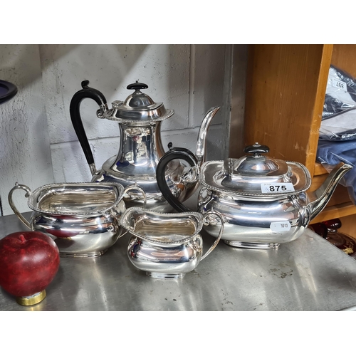 875 - A selection of antique silver plate items including a coffee pot, teapot, sugar bowl and creamer fea... 