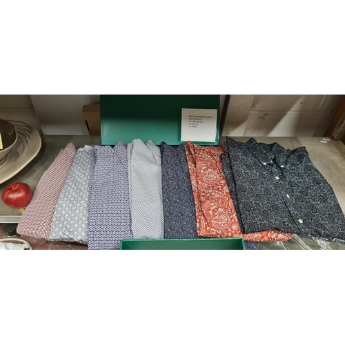 886 - A box containing seven mens designer shirts in size medium. Brands include Ted Baker, Relco, and Mer... 