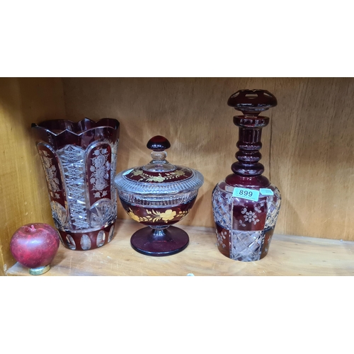 899 - Three vintage pieces of Bohemian Ruby red cut glass including a tall vase, lidded pedestal vase and ... 