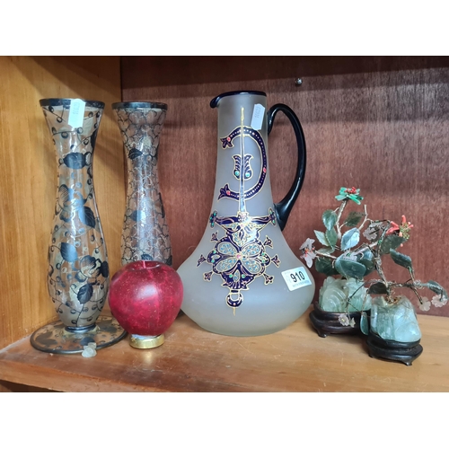 910 - Four decorative items including a hand painted frosted glass carafe. Along with two Chinese calcite ... 