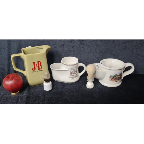 921 - Three vintage items including a Wade J&B Scotch Whisky jug and two gentleman's shaving mugs.