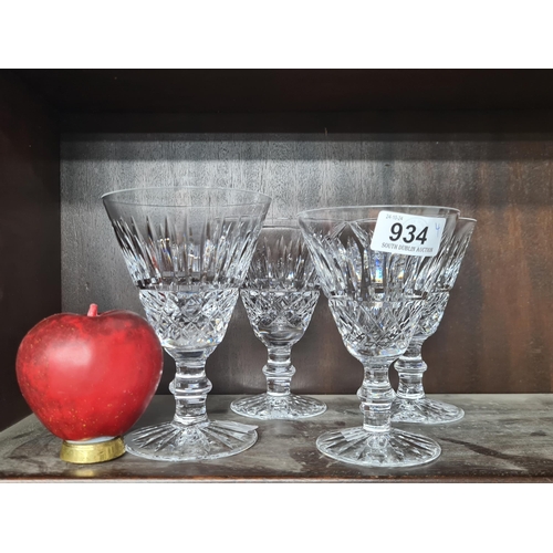 934 - An assortment of four 'Waterford' crystal glasses. Features 'Tramore pattern'. With acid marks to ba... 