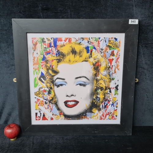 945 - A print after 'Mr. Brainwash' titled 'Marilyn Monroe'. Housed in a black frame behind glass.