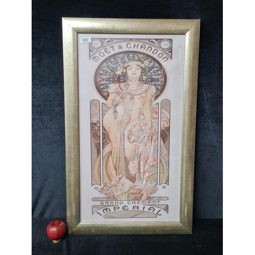 947 - A large print after 'Alphonse Mucha' titled 'Moet and Chandon'. Housed in a gilt frame behind glass.... 