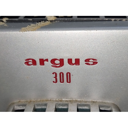 776 - Argus 300 vintage projector in original case. Classic mid-century design.