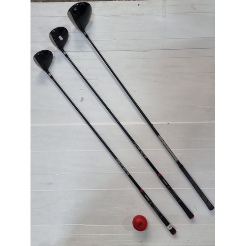 779 - Set of three golf clubs featuring Aldila VX shafts and Golfsmith grips, including a Snake Eyes model... 