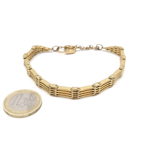 1055 - A nice gold plated bar bracelet with safety chain and padlock lock. Nice quality heavy looks gold. 2... 