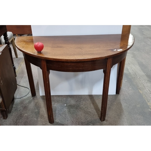 1132 - Mahogany demilune console table, from the early 20th century. Approximately 30 inches high, 36 inche... 