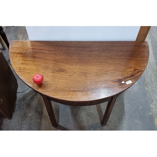 1132 - Mahogany demilune console table, from the early 20th century. Approximately 30 inches high, 36 inche... 