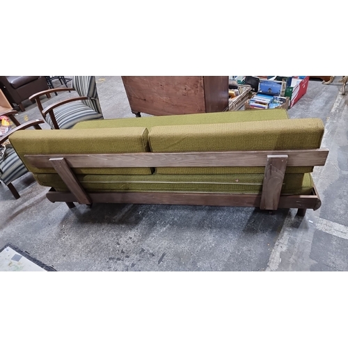 1154 - Star lot : A rare Mid century Modern American sofa with green upholstery and wooden frame. Approxima... 