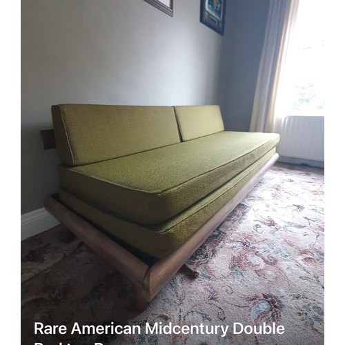 1154 - Star lot : A rare Mid century Modern American sofa with green upholstery and wooden frame. Approxima... 