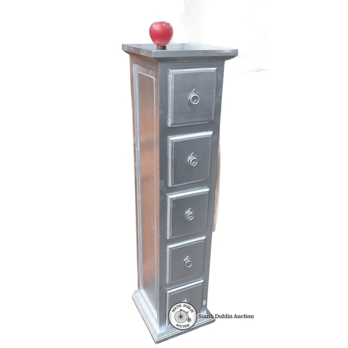 1157 - Silver-finished narrow chest of drawers, featuring five drawers with ring handles and a decorative a... 