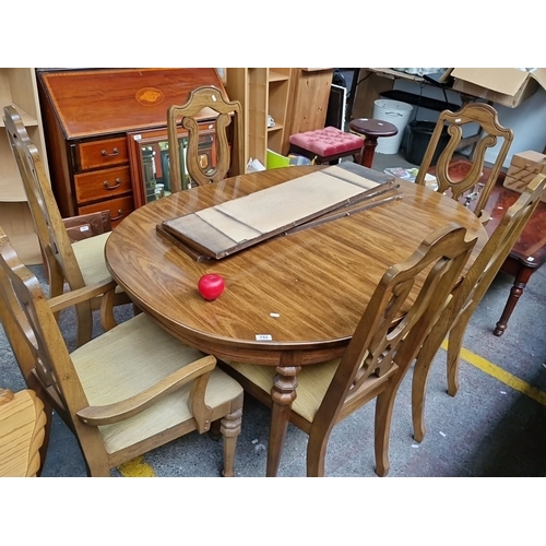 1167 - Star lot : A lovely Oak extending  dining table and chairs set includes six chairs with carved backs... 