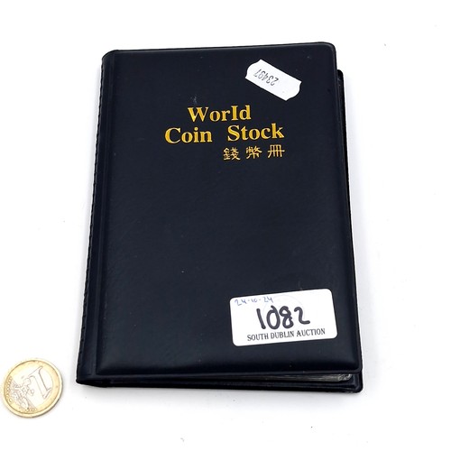 1082 - A World Coin Stock album approx. 50% full, including British 1967 half pennies, early to mid century... 