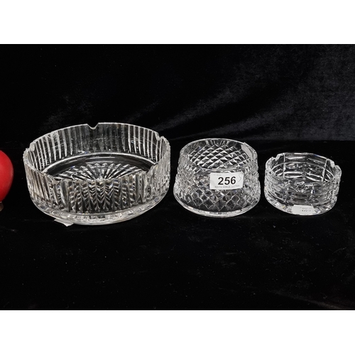 1231 - Three Waterford Crystal items including a cigarette ashtray, a pillar candle holder, and a large cig... 