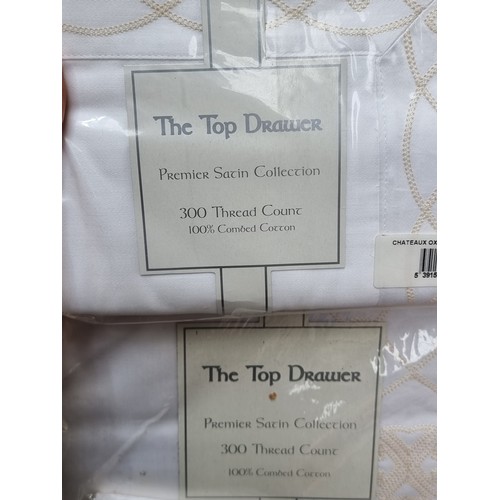 399 - A bag of mixed clothes and fabrics all in new or super condition including a new Barbour dressing go... 