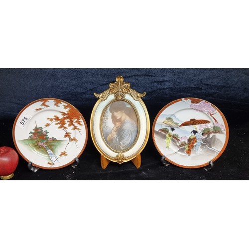 575 - Three items comprising of two beautifully hand painted Japanese Kutani porcelain plates with display... 