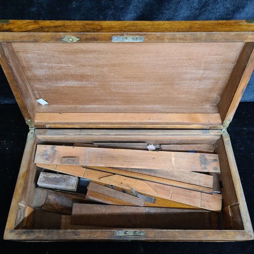 241 - A beautiful large antique walnut lidded storage box boasted brass cornering and cartouche.