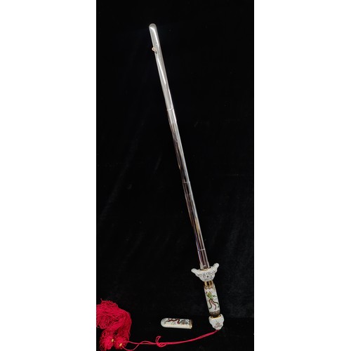 253 - A vintage enameled Japanese telescopic Tai Chi sword, similar online for €137.00.