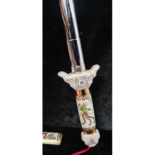 253 - A vintage enameled Japanese telescopic Tai Chi sword, similar online for €137.00.