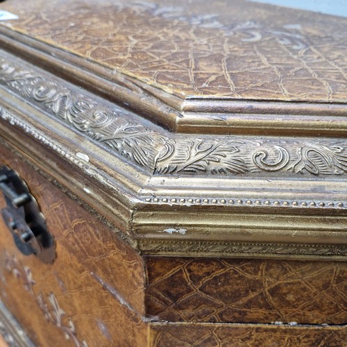 382 - A large and impressive lidded storage/blanket box featuring gilt gold foliate detail, large brass hi... 