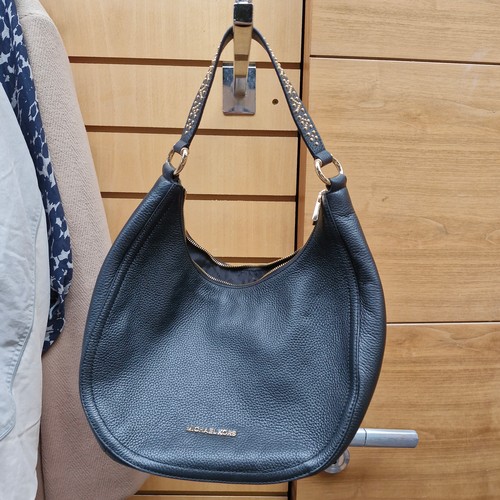 388 - A mixed lot of stylish ladies handbags including examples from Michael Kors, Jonathan Adler and Orla... 